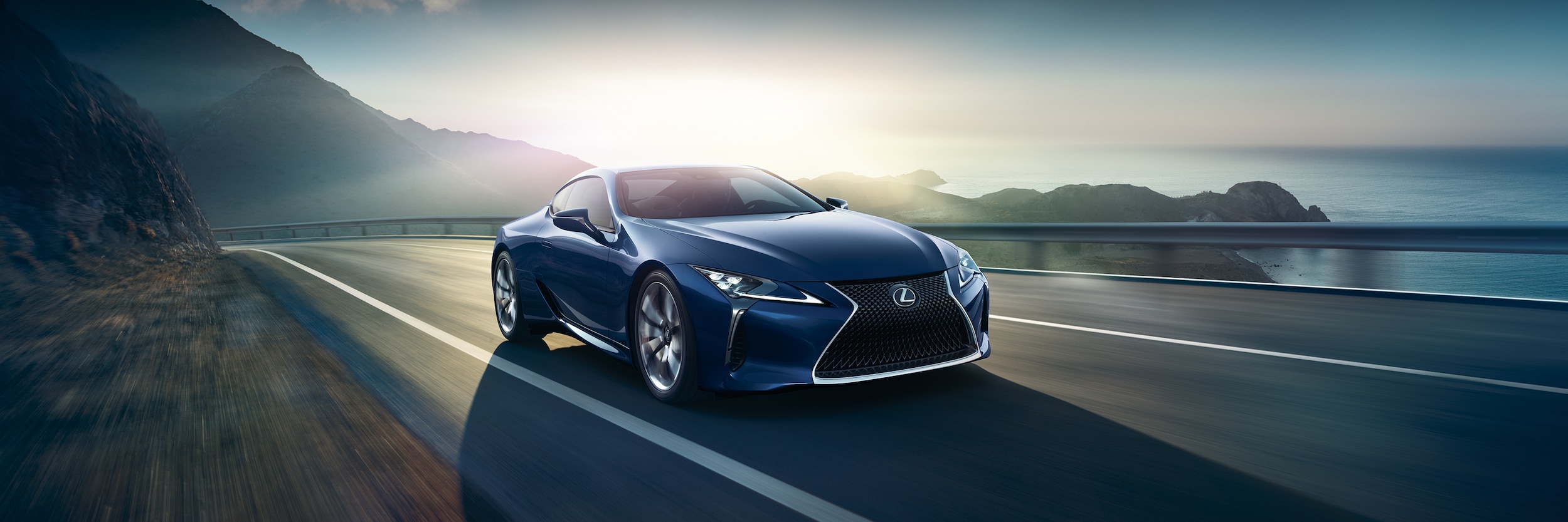 Lexus LC Blue Lexus LC driving on a highway