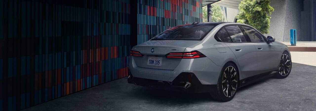 2025 BMW i5 red 2025 BMW i5 parked in city setting