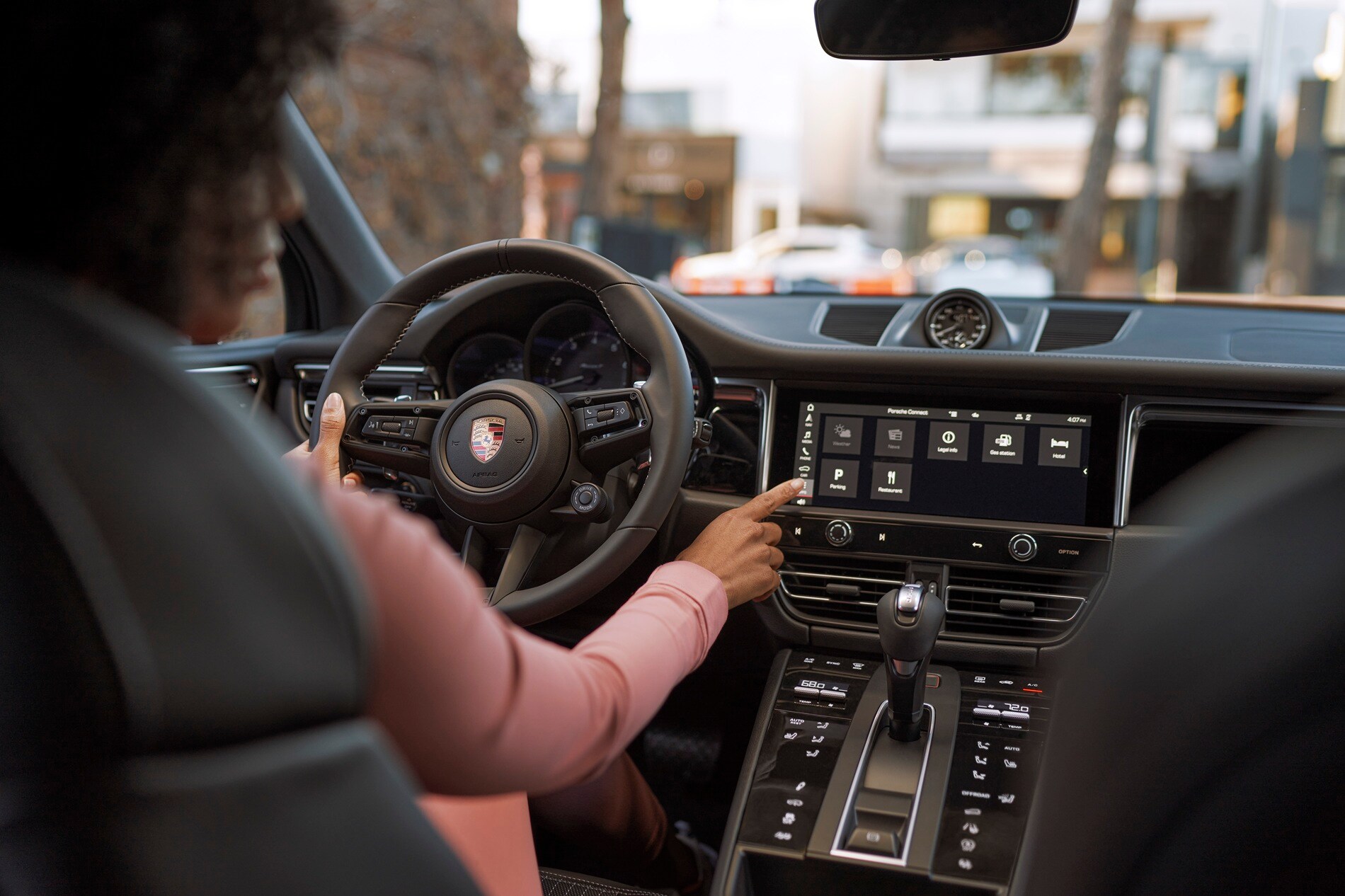 Porsche Macan interior interior view of person driving a Porsche Macan