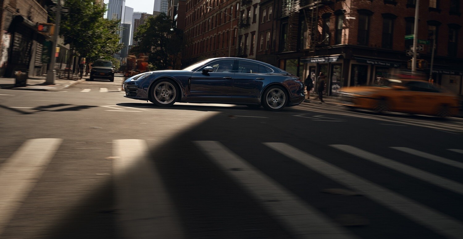 Porsche Panamera 4 Porsche Panamera 4 driving on a city street