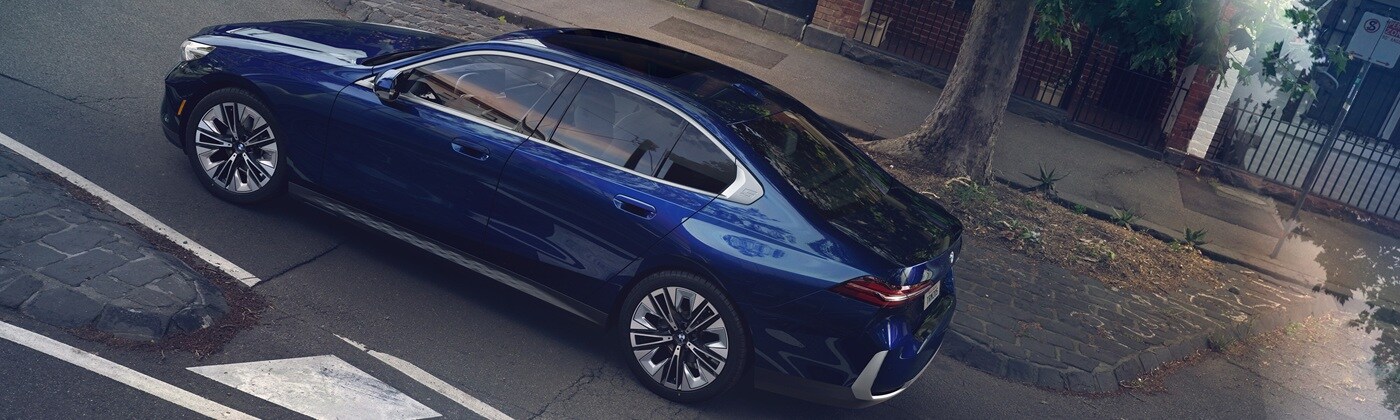 BMW 5 Series sedan Dark Blue BMW 5 Series Sedan seen from above driving on a city street