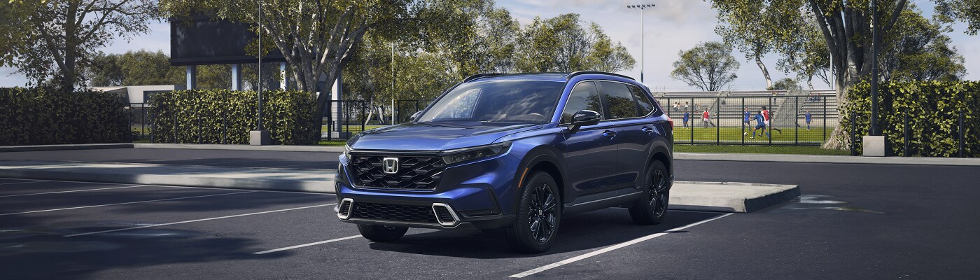 2023 Honda CR-V Sport Touring Blue CR-V Sport Touring parked in a parking lot
