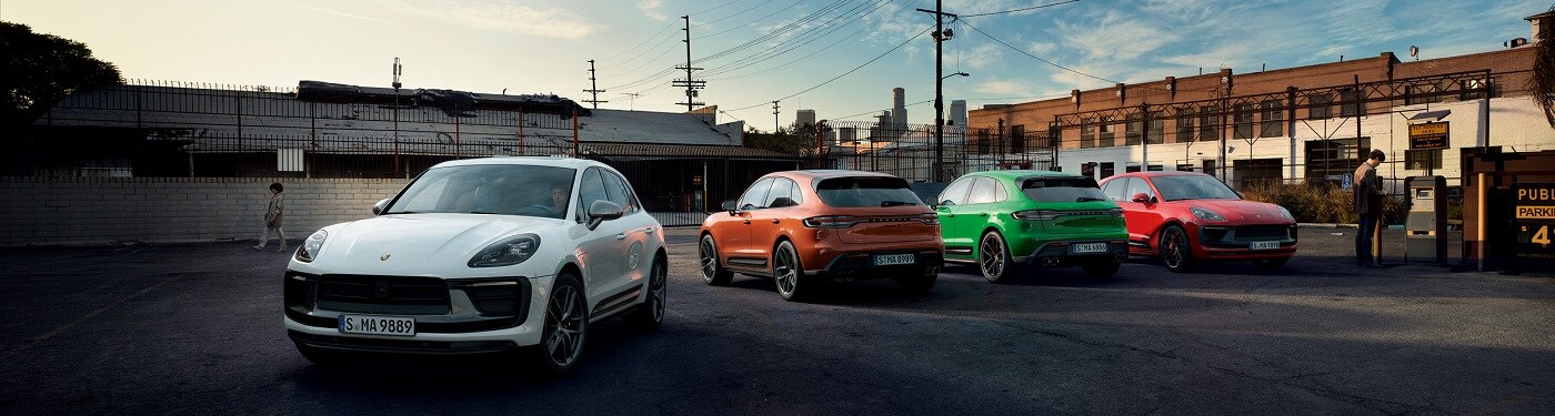 Porsche SUVs Porsche SUV Models parked in an industrial area