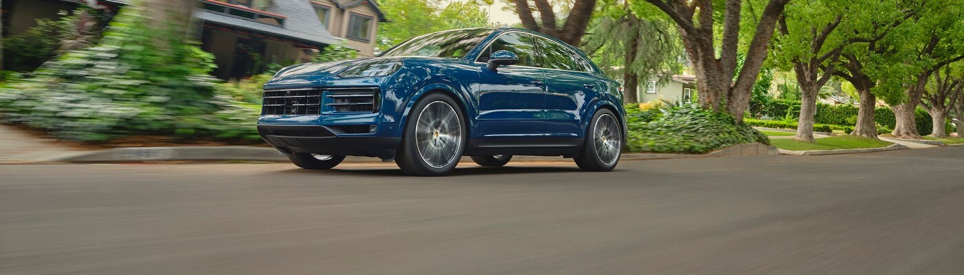 Porsche Cayenne Coupe Cayenne Coupe driving in a neighborhood