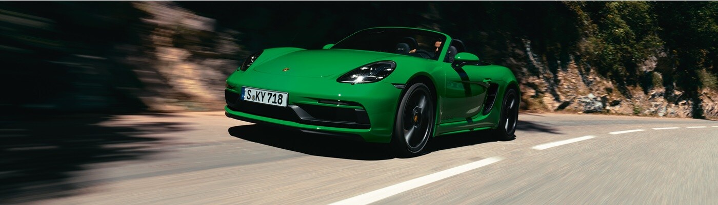 Porsche 718 Boxster Green 718 Boxster GTS 4 driving on a mountain road