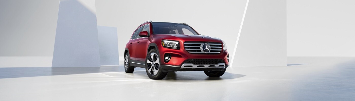 Mercedes-Benz GLB Red Mercedes-Benz GLB parked in a white modern space