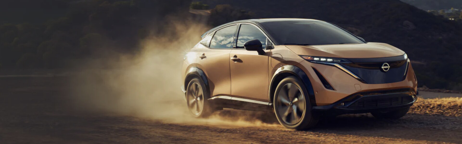 2024 Nissan ARIYA running on sand.png 2024 Nissan ARIYA running on sand
