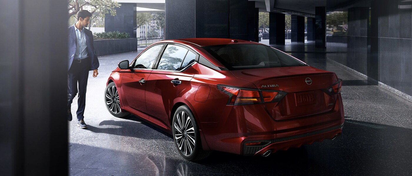 2023 Nissan Altima Inventory Page man standing next to vehicle.png 2023 Nissan Altima Inventory Page man standing next to vehicle