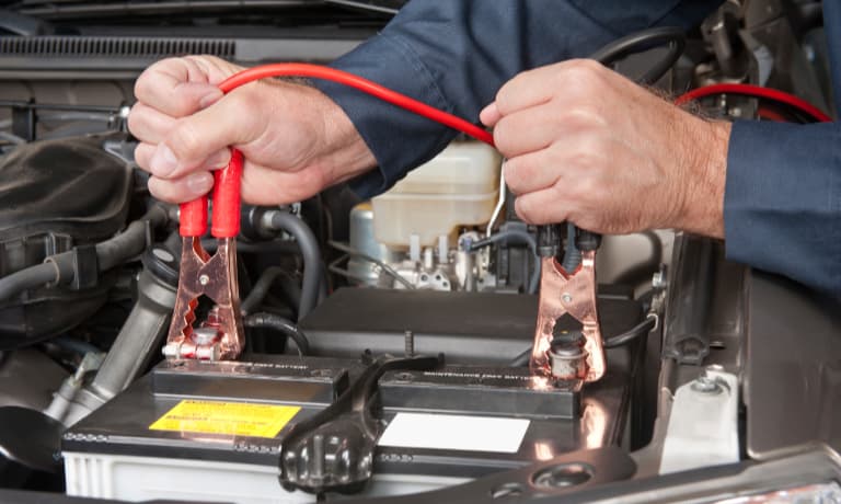 man testing car battery