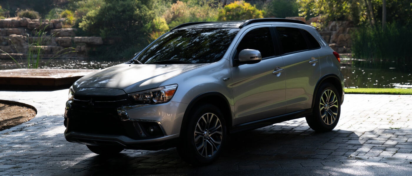 2019 Mitsubishi Outlander Sport parked underneath tree