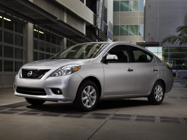 2014 Nissan Versa sedan silver angled facing left.jpg