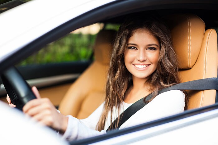 woman-test-driving-car.jpg Happy woman test driving a car