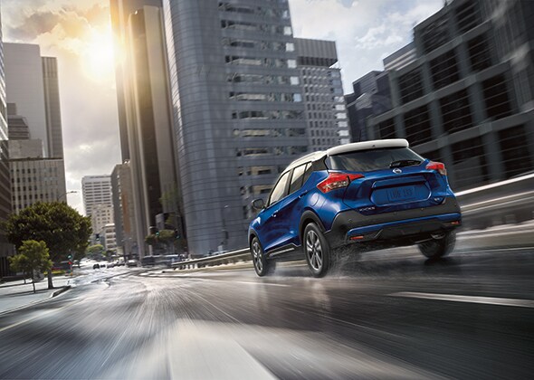 2020_Nissan_Kicks_Exterior.jpg New 2020 Nissan Kicks blue exterior driving on city road