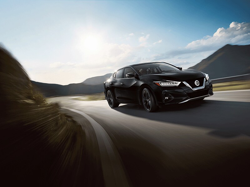 2020 Nissan Maxima Exterior Driving New 2020 Nissan Maxima black exterior driving on country road