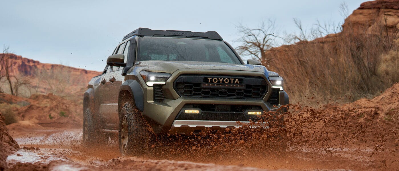 2024 Toyota Tacoma Exterior Driving Through Mud