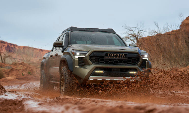 2024 Toyota Tacoma Exterior Driving Through Mud