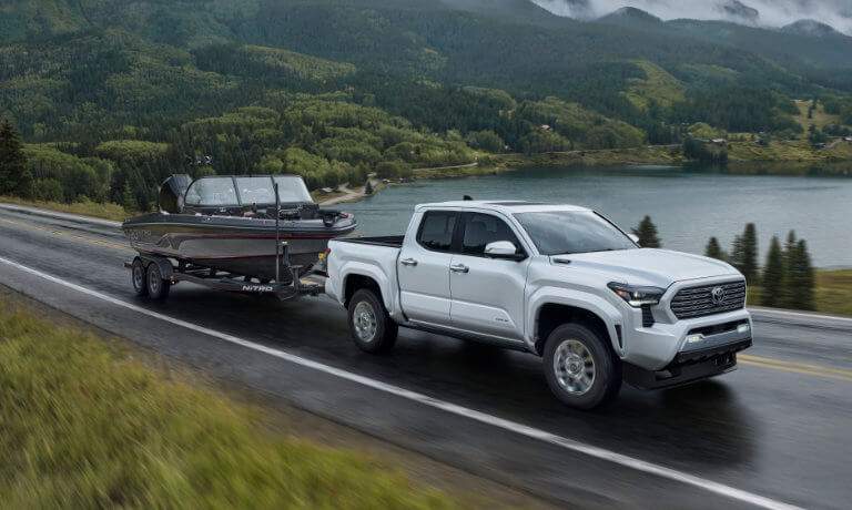 2024 Toyota Tacoma Exterior Towing Boat On Lake Road
