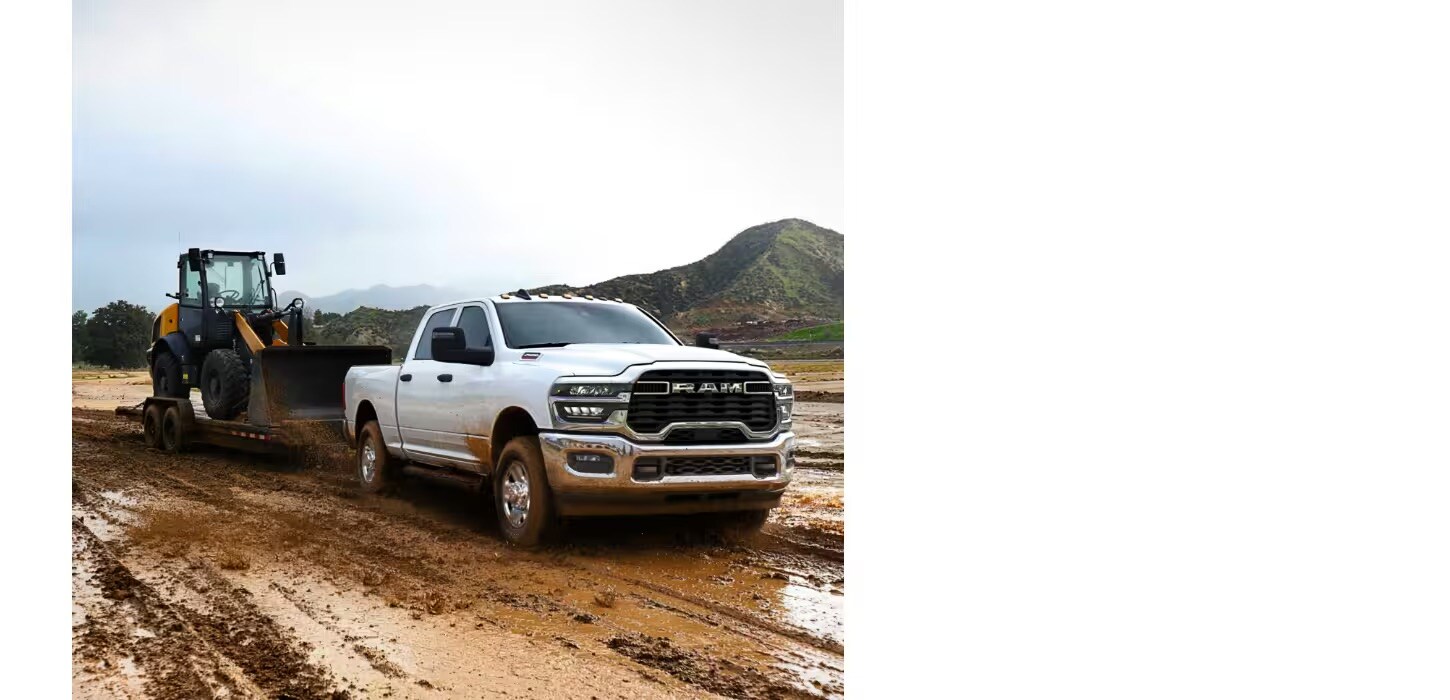 2026 Ram 2500 towing heavy machinery