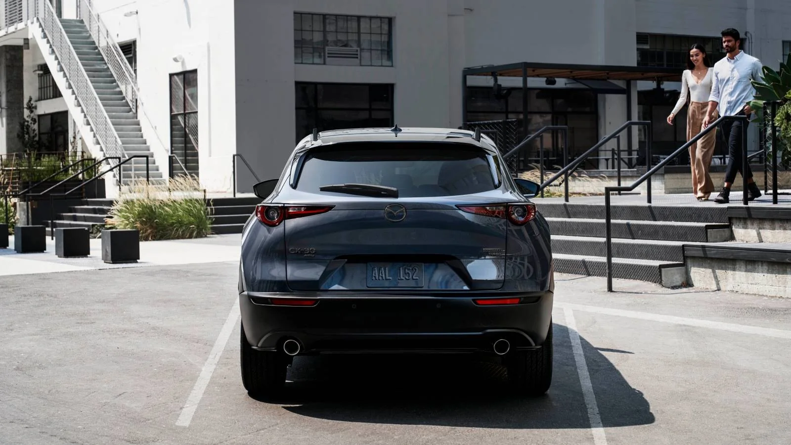 Mazda CX-30 rear exterior parked in an urban lot, Sport Durst Mazda Durham NC