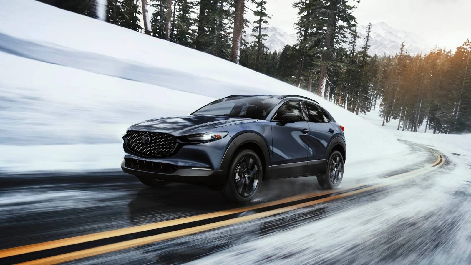 Mazda CX-30 with i-Activ AWD on a wet two-lane road, Mazda dealership near Wake Forest, NC