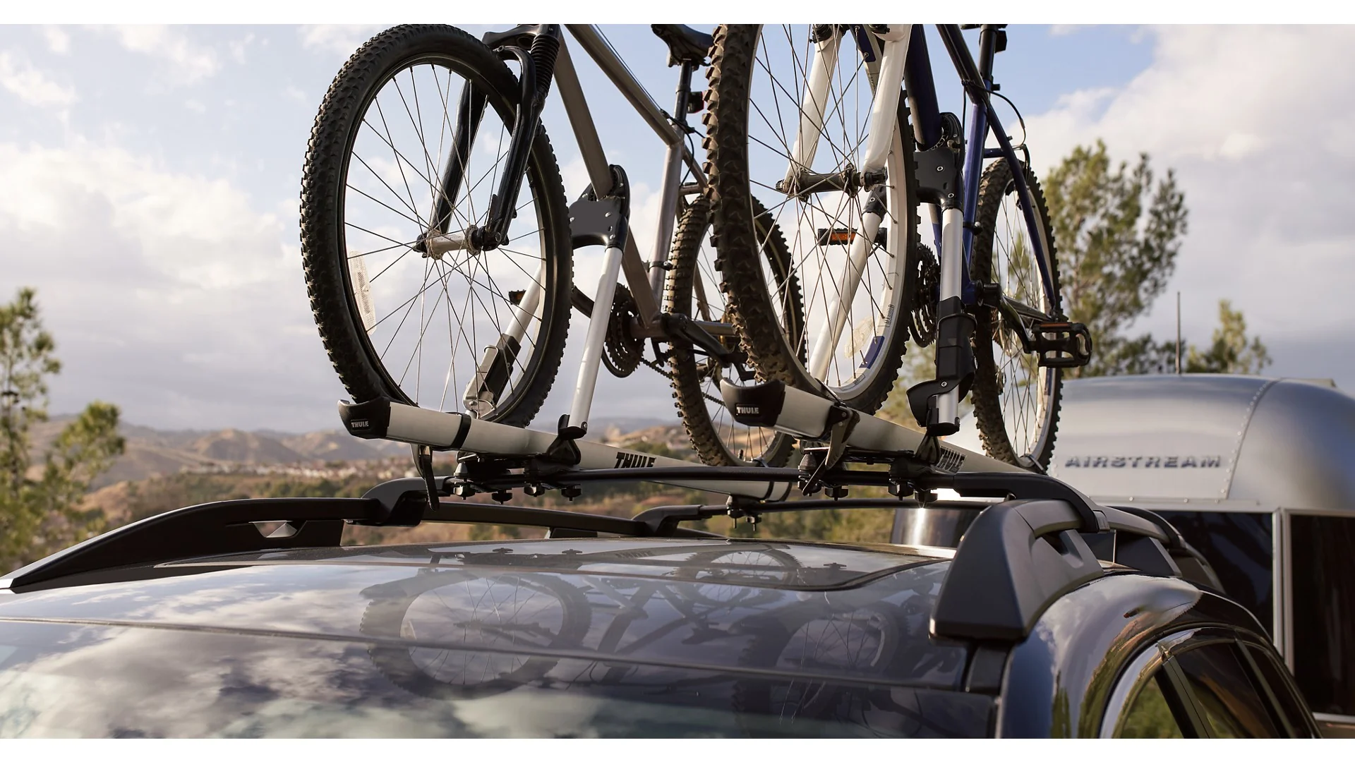 Bikes mounted on the standard raised roof rails of a Subaru Ascent