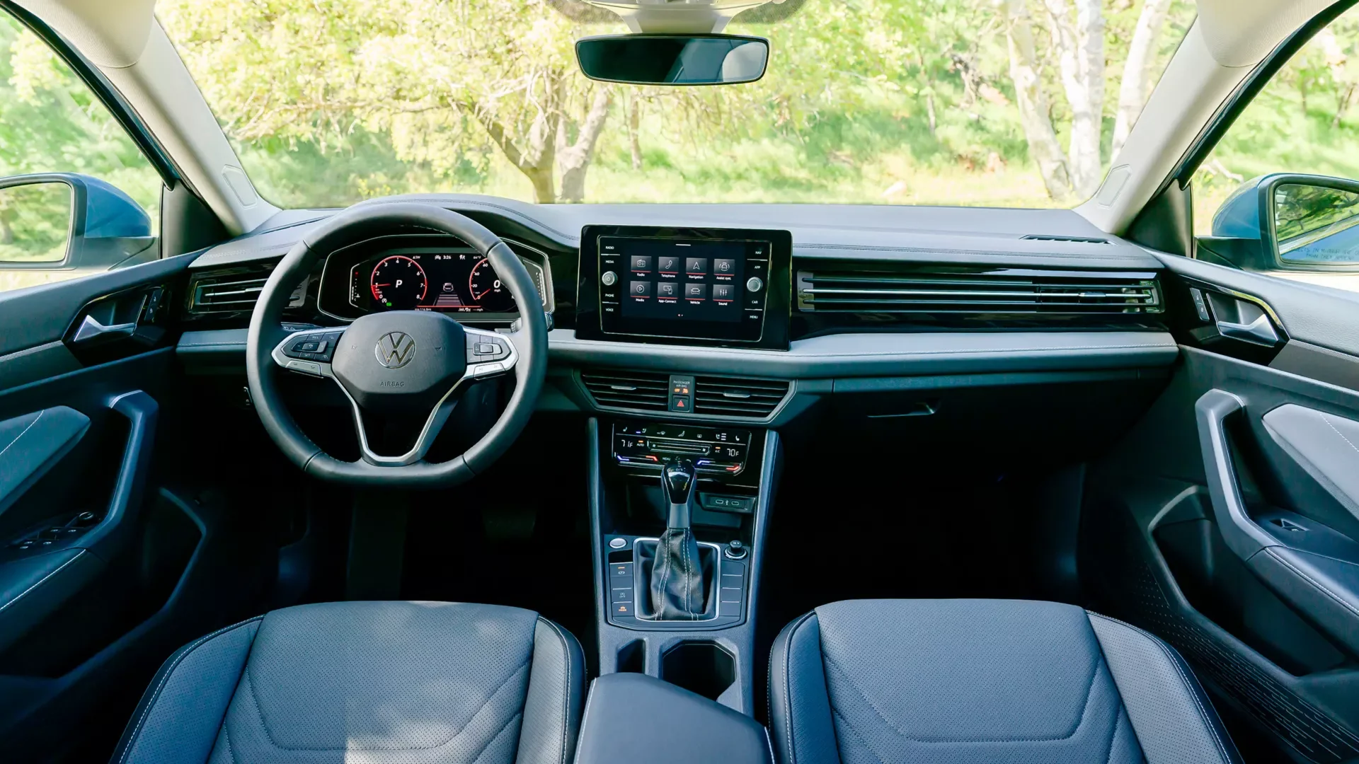 2026 Volkswagen Jetta interior dashboard with the center touchscreen, digital instrument cluster and center console