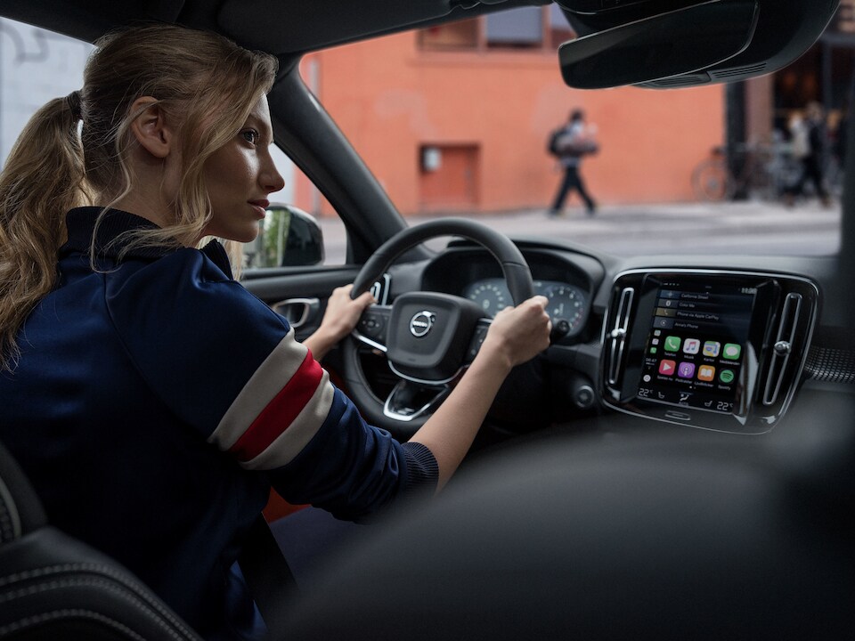 Woman driving Volvo car.jpeg