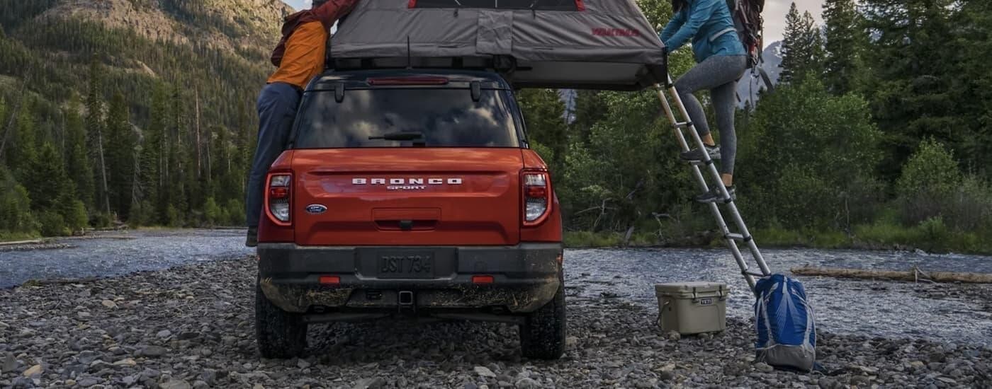 Ford%20Bronco%20Sport%20for%20Sale%20wlp%202.jpg An orange 2023 Ford Bronco Sport parked near a river.