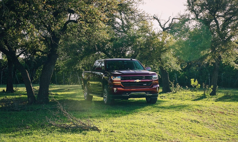 Red 2018 Chevy Silverado in field