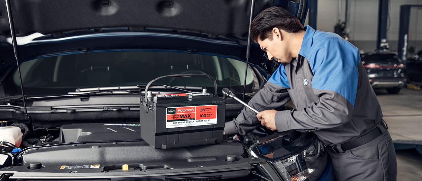 Ford Service Technician Ford service technician changing battery