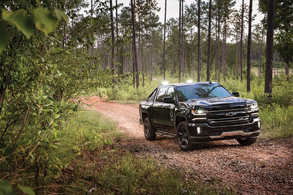 2017 Chevy Silverado 2017 Chevy Silverado driving through trees