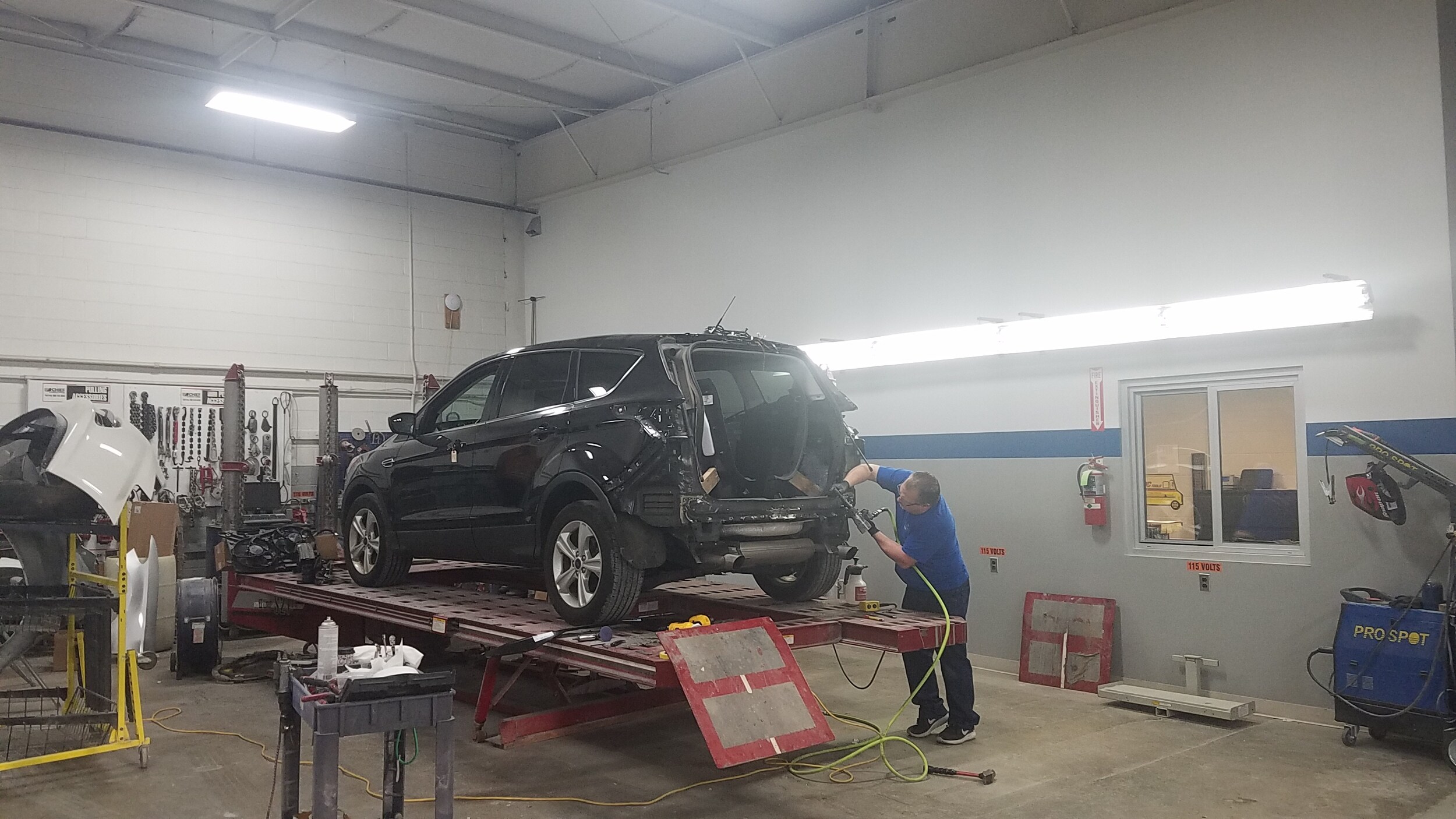 Stillwell Ford Body Work SUV receiving body work in the Stillwell Ford Body Shop in Hillsdale, MI