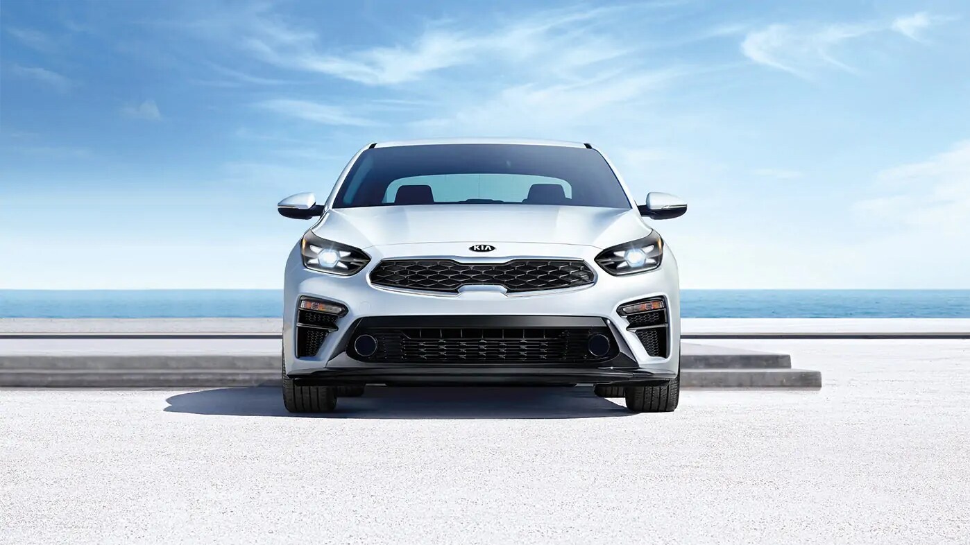 White 2021 Kia Forte Parked By Water White 2021 Kia Forte Parked By Water