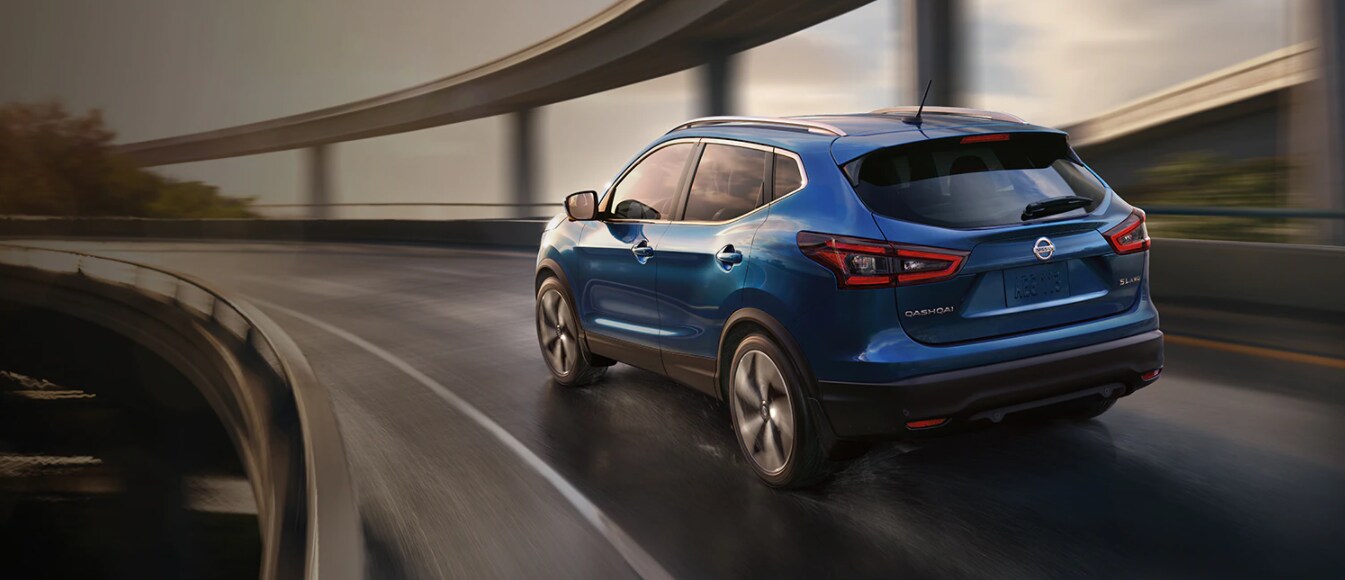 Blue 2021 Nissan Qashqai Driving On Highway.png