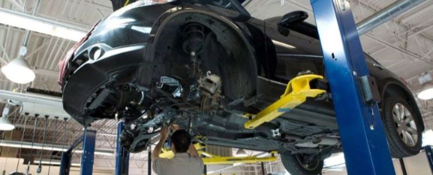 Subaru on a Jack in a Repair Shop