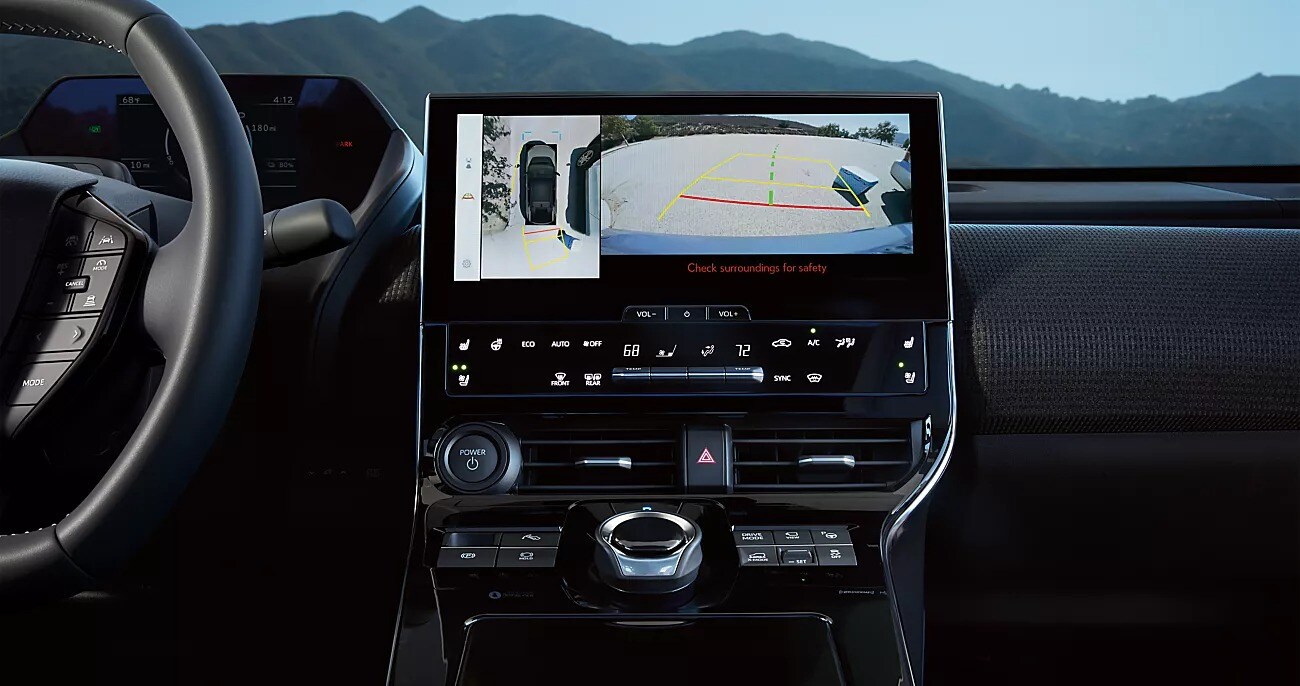 View of two passengers in a 2025 Subaru SUV looking down through the panoramic moonroof View of two passengers in a 2025 Subaru SUV looking down through the panoramic moonroof