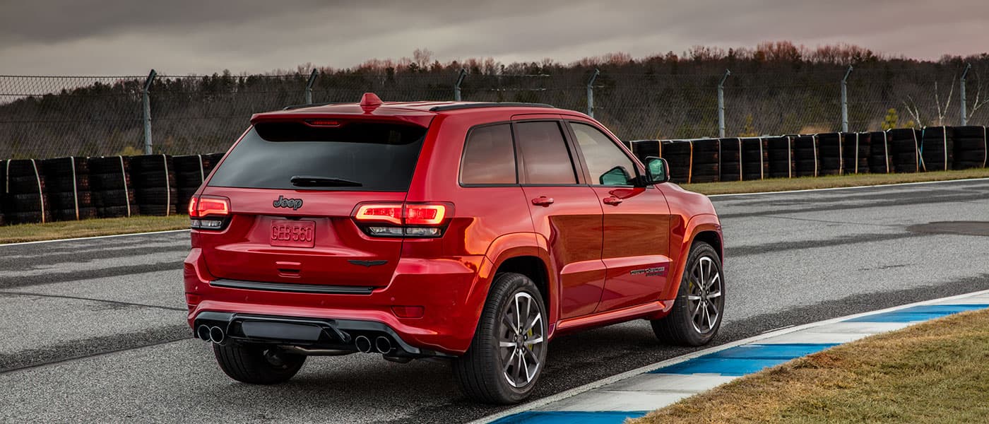 2019 Jeep Grand Cherokee Red 2019 Jeep Grand Cherokee driving on racetrack