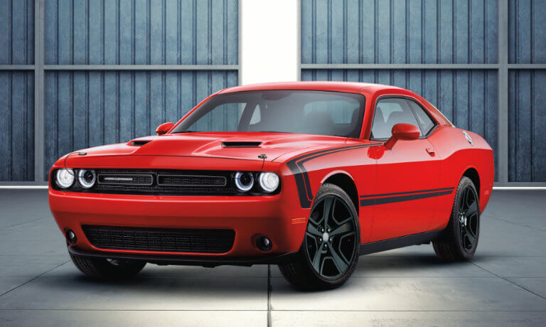 2023 Dodge Challenger parked inside an airport hanger