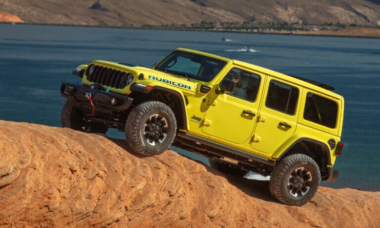 2025 Jeep Wrangler 4xe parked on a boulder