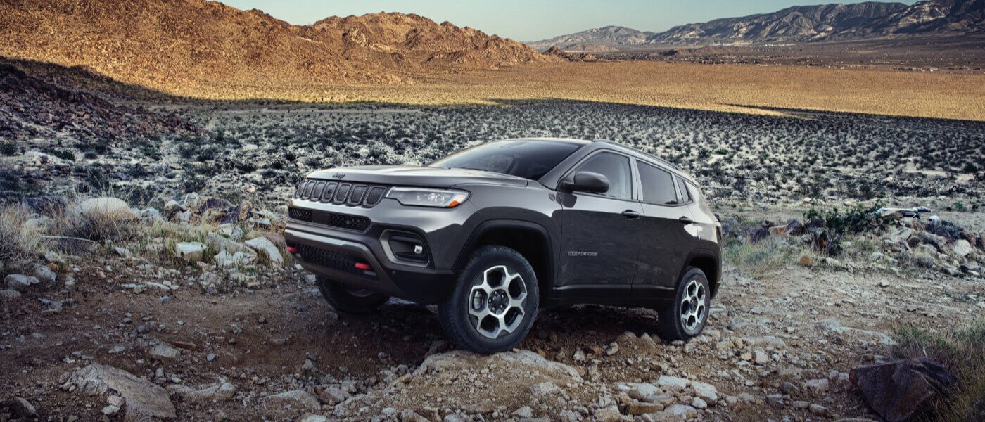 2024 Jeep Compass parked near a desert
