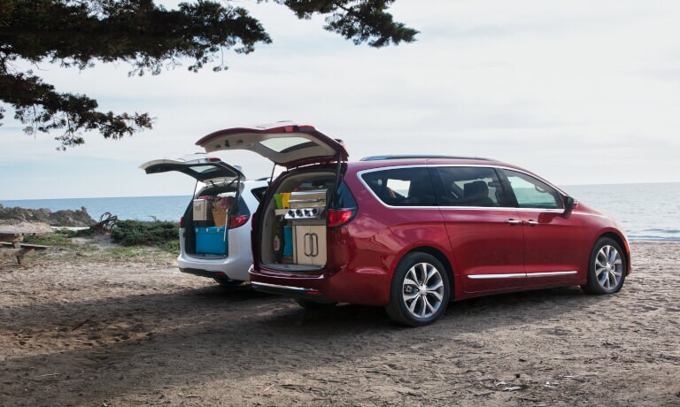 2020 Chrysler Pacifica exterior two parked by water with hatches open