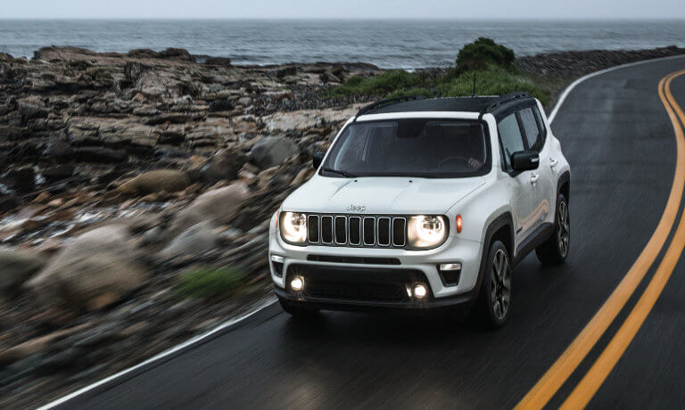 2023 Jeep Renegade driving on a coastal road