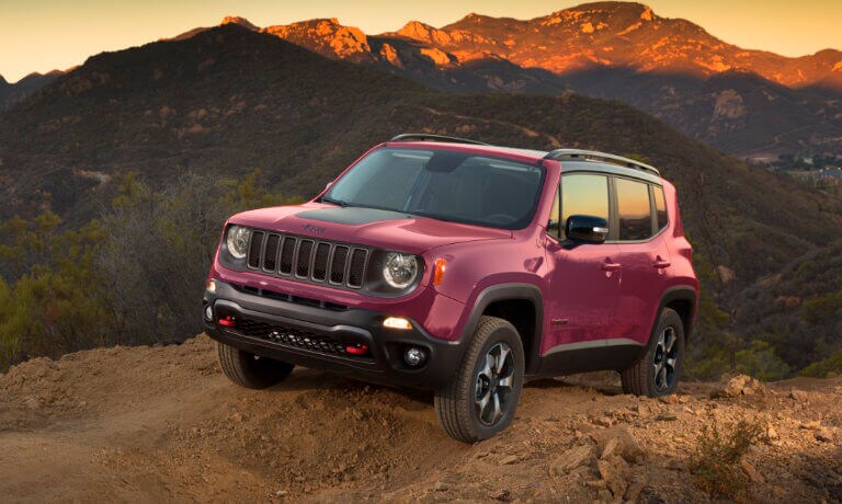 2023 Jeep Renegade driving by the sunset