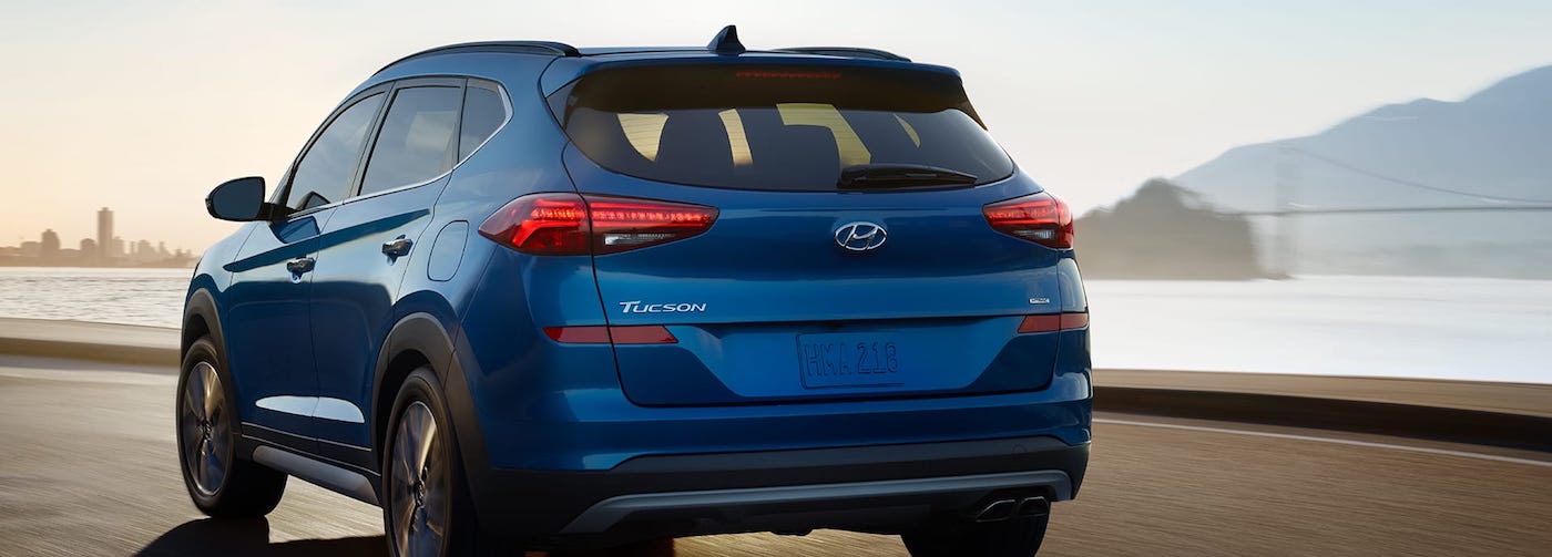 blue 2019 tucson driving on highway