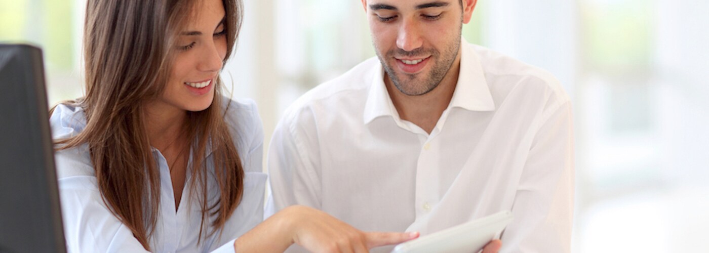 couple looking at touchpad together