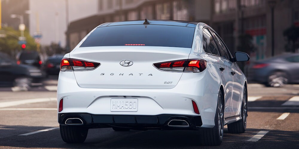 White 2019 Hyundai Sonata Driving in
City