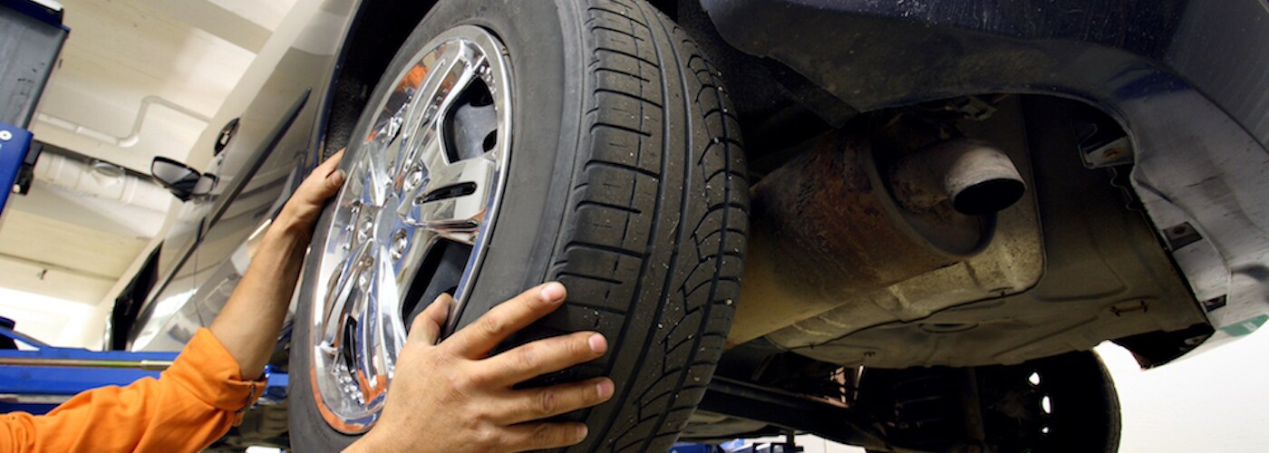 mechanic rotating tires