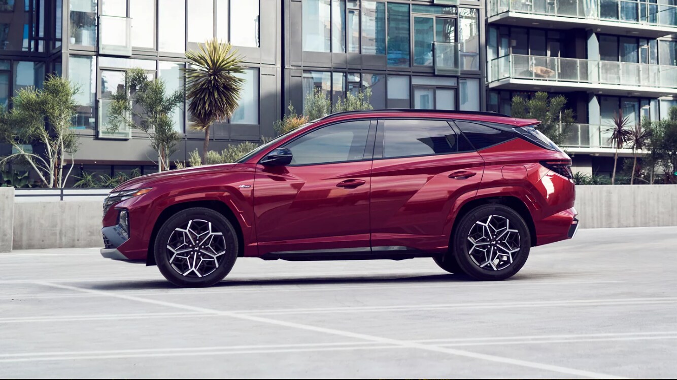 2024 Hyundai Tucson N-Line in Ultimate Red parked in a parking spot 2024 Hyundai Tucson N-Line in Ultimate Red parked in a parking spot