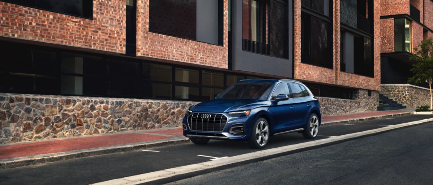 Blue 2021 Audi Q5 Parked Outside Apartments