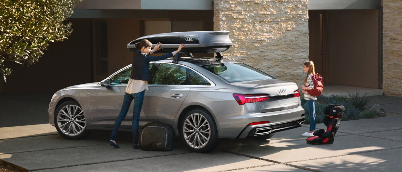 2021 Audi A6 with family packing up